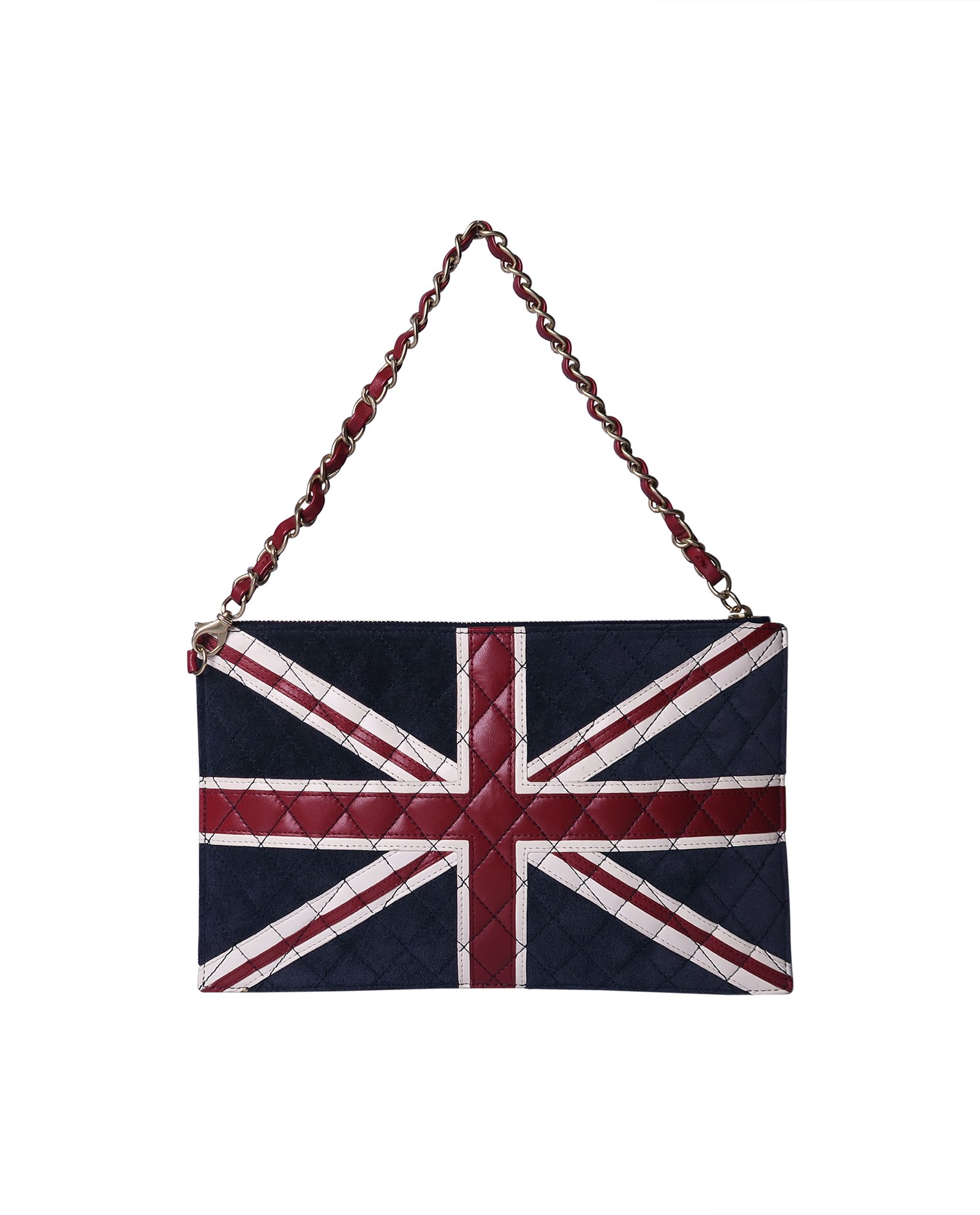 LONDON, UK. 11 March, 2022 . A staff member presents a Chanel Union Jack  shoulder bag, Estimate £2,000 – 3,000 alongside other luxury handbags with Louis  Vuitton trunk luggage which will be