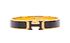 Hermès Click H Bracelet, £420, Jewellery, Black/Gold, Brass, Front view